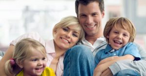 Smiling family celebrating Father's Day